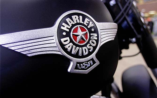 In this Jan. 20, 2012 photo, the Harley-Davidson logo is displayed on a new motorcycle for sale in the show room of Hall's Harley-Davidson Cycles, in Springfield, Ill.