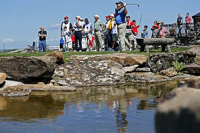 Brad Bryant tees off on the first hole of the Top of the Rock golf course during the second round of competition of the Champions Tour's Bass Pro Shops Legends of Golf tournament in Ridgedale, Mo., Saturday, April 25, 2015. (Guillermo Hernandez Martinez/The Springfield News-Leader via AP)