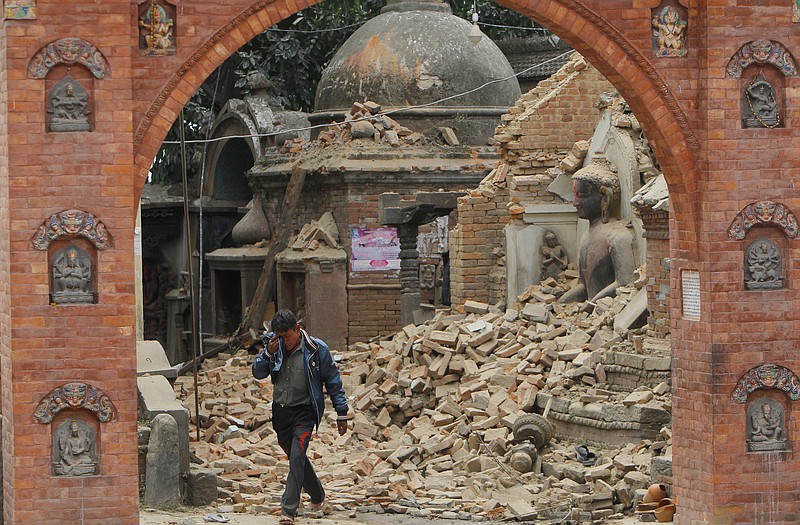 A Nepalese man cries as he walks through the earthquake debris inÂ Bhaktapur, near Kathmandu, Nepal, on Sunday.