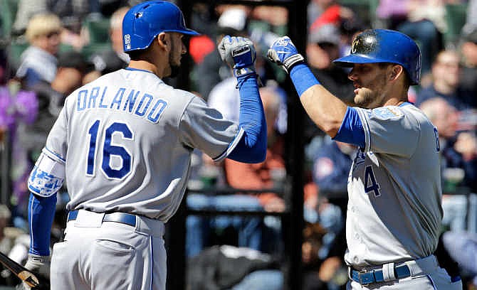Kansas City Royals' Alex Gordon, right, celebrates with teammate Paulo Orlando after hitting a two-run home run during the fourth inning of a baseball game against the Chicago White Sox in Chicago on Sunday, April 26, 2015.