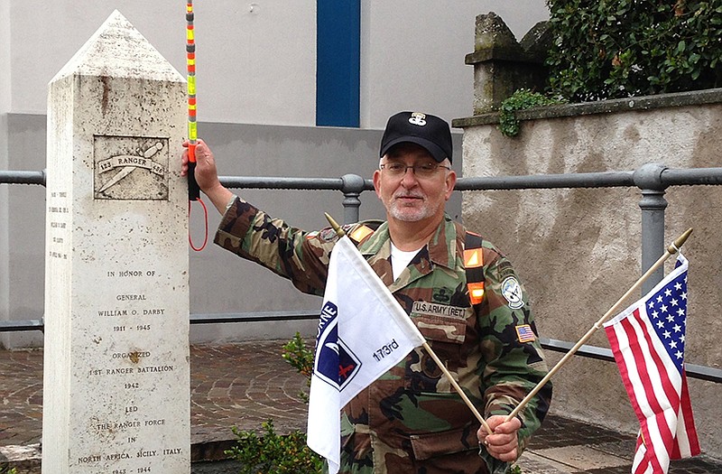 Rick Tscherne poses with a memorial to Col. William O. Darby in Torbole, Italy. The former U.S. Army Ranger is organizing a 40-mile road march in northern Italy to commemorate the 70th anniversary of the deaths of Darby, a legendary World War II officer, and 25 of his soldiers on the same day.

