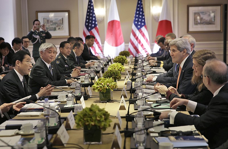 Japanese Foreign Minister Fumio Kishida, left, and Defense Minister Gen Nakatani, second from left, attend a meeting with U.S. Secretary of State John Kerry, third from right, and Secretary of Defense Ashton Carter, not visible, in New York. Japan and the U.S. signed off on revisions to the U.S.-Japan defense guidelines, boosting their defense relationship to allow a greater Japanese role in global military operations with an eye on potential threats from China and North Korea. 