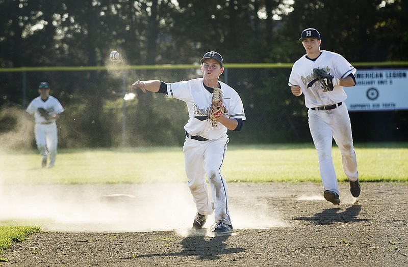 Helias second baseman John McDonald throws to first for an out in front of shortstop Alex Faddoul during Tuesday's game against Blair Oaks at the American Legion Post 5 Sports Complex.