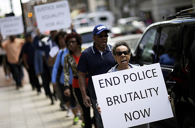 Protestors demonstrate outside the state attorney's office calling for the continued investigation into the death of Freddie Gray, Wednesday, in Baltimore. Activists stressed that they will continue to press for answers in the case of Gray, the 25-year-old black man whose death from a spinal-cord injury under mysterious circumstances while in police custody set off the riots.