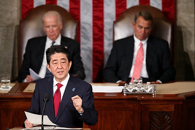 Japanese Prime Minister Shinzo Abe speaks before a joint meeting of Congress Wednesday on Capitol Hill in Washington. Vice President Joe Biden and House Speaker John Boehner of Ohio sit behind the prime minister.