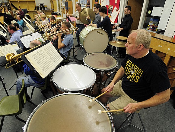 Tom Higgins mans the tympani as members of the Jefferson City Symphonic Orchestra rehearse for their final performance of the 2014-15 concert season.