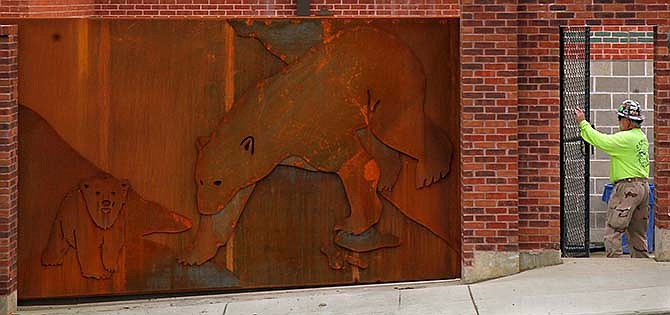 A decorative gate with a polar bear theme marks a service entrance to the new McDonnell Polar Bear Point under construction on Monday, April 13, 2015 at the St. Louis Zoo. The Buffalo Zoo has applied to move its bear to the new facility, scheduled to open June 6. (Robert Cohen/St. Louis Post-Dispatch via AP)