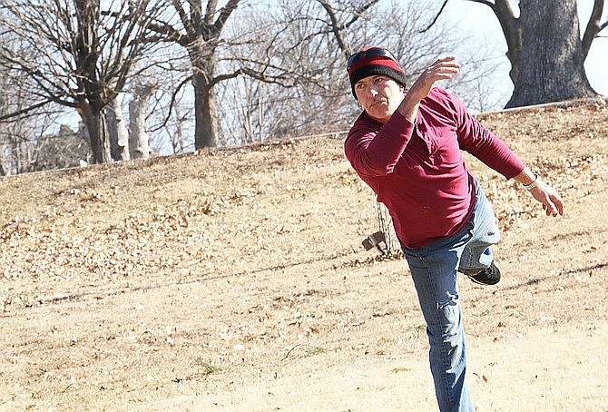 Jerome Ciolli of California, Missouri follows through on a toss during the Ice Bowl disc golf fundraiser in February at Veterans Park. The Fulton Disc Golfers club will host another tournament on May 9.