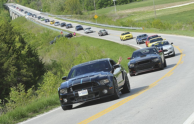 Shelbyfest founder Kyle Caraway leads the parade of 66 vehicles, mostly Mustangs, on Route B through Cole County on their way to St. Thomas, Meta and Westphalia before returning to Jefferson City to continue in the weekend's activities. A number of area residents joined in the afternoon countryside cruise on the weather-wise perfect afternoon.
