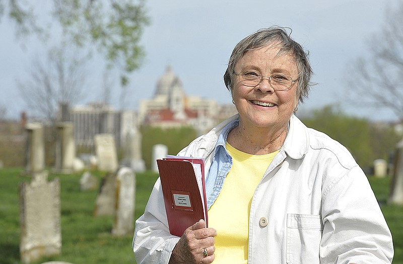 Nancy Thompson stands in the Old City/Woodland Cemetery.
