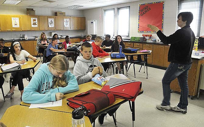 Students in Ashley Schmitz's seventh-grade classroom at Jefferson City's Thomas Jefferson Middle School are seated as they listen during her lecture.