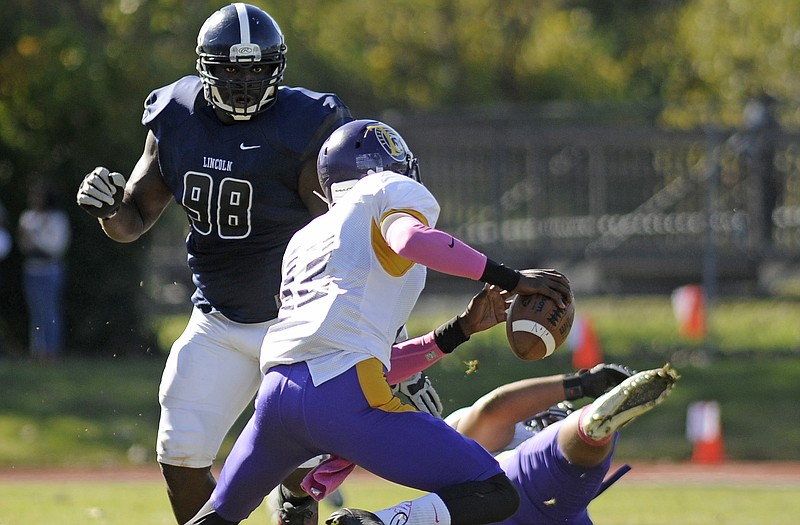 After tossing a Texas College lineman to the ground, Lincoln defensive lineman Davon Walls charges after the quarterback during a game last season at Dwight T. Reed Stadium.