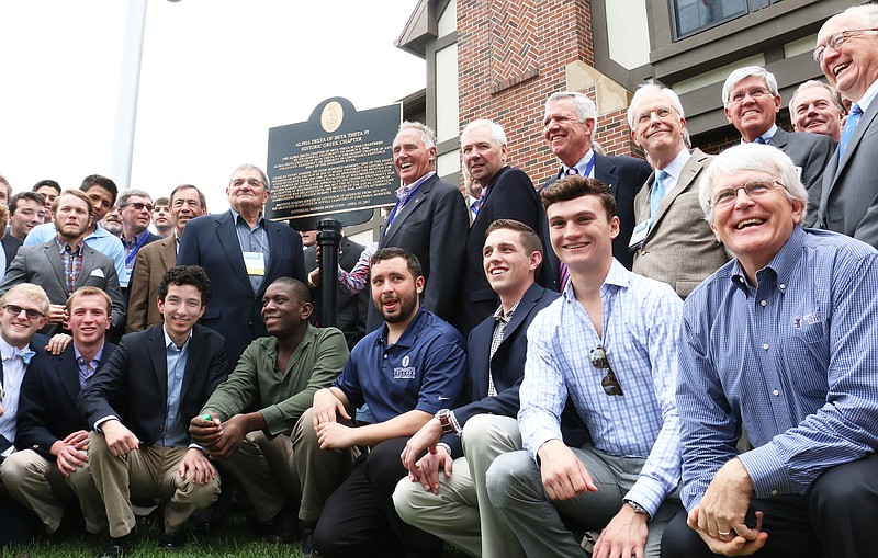 Alpha Delta chapter of Beta Theta Pi at Westminster College alumni and current students pose for a photo with the chapter's new historic marker sign.
