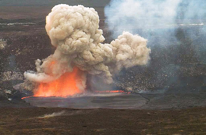 Ssmoke and lava explode from Kilauea volcano on Hawaiis Big Island. Molten lava and rocks went flying through the air after part of the crater wall collapsed and caused the explosion. 