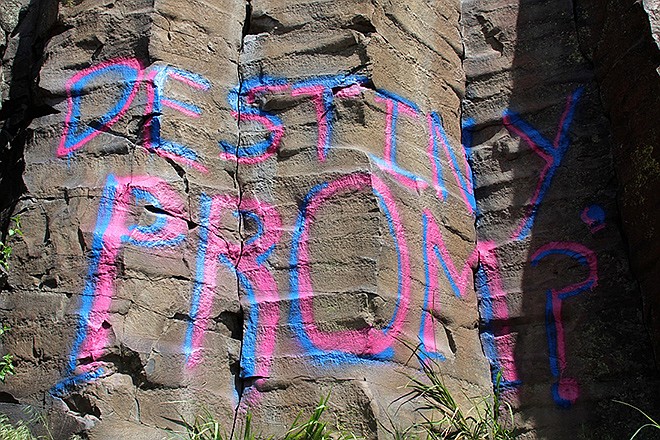 "Destiny, Prom?" painted in large pink and blue letters on the side of the Black Cliffs east of Boise.  Authorities are looking for a teen who wanted a date with Destiny and hoped to get it by spray-painting a prom proposal on an Idaho cliffside.