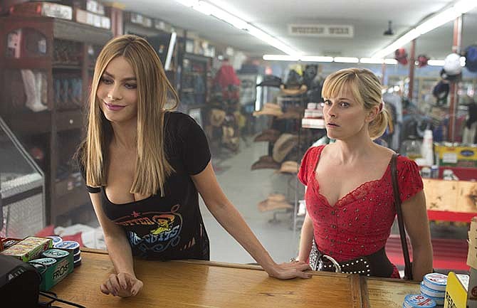 In this image released by Warner Bros. Pictures, Reese Witherspoon, right, and Sofia Vergara appear in a scene from "Hot Pursuit." 
