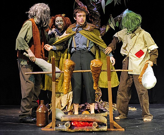 Bilbo Baggins, center played by Andrew Hawcroft finds himself surrounded by a trio of trolls played by, from left, Benjamin Bommel, Hope Kirk and C.J. Willower as members of the Jefferson City Home Educators Teen Club rehearse for their upcoming production of "The Hobbit" at Lincoln University's Pawley Theater.