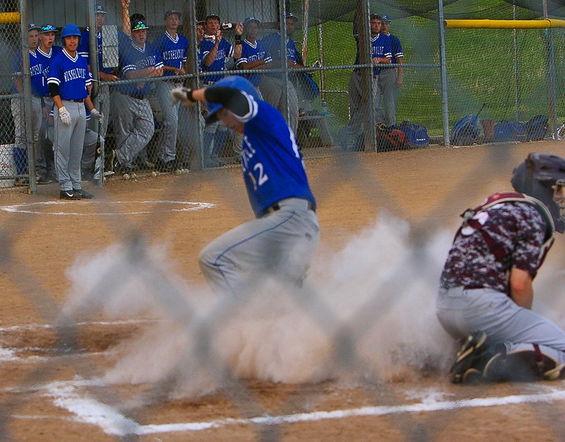 Seth Kuda slides into home during Russellville's 15-5 win against Osage Friday, May 1. 