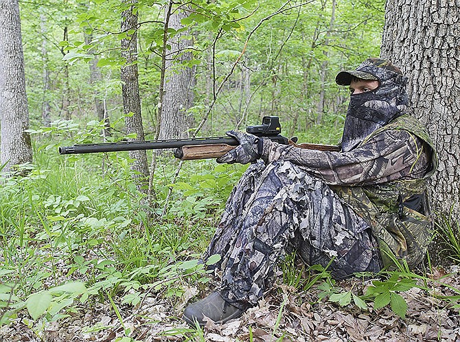 After waking up before dawn Tuesday and hunting for wild turkeys along a wooded ridge not far from the Missouri River, Tory Smith waits patiently for a gobbler. The Boone County native has been participating in the state's spring turkey hunt for about eight years.
