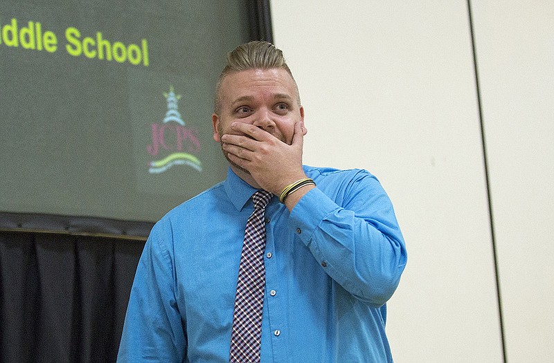 Lewis and Clark Middle School teacher Jeff Luttrell reacts after being named the Jefferson City Public Schools 2015 Teacher of the Year during the annual Teacher Appreciation Dinner at Lewis and Clark Thursday.