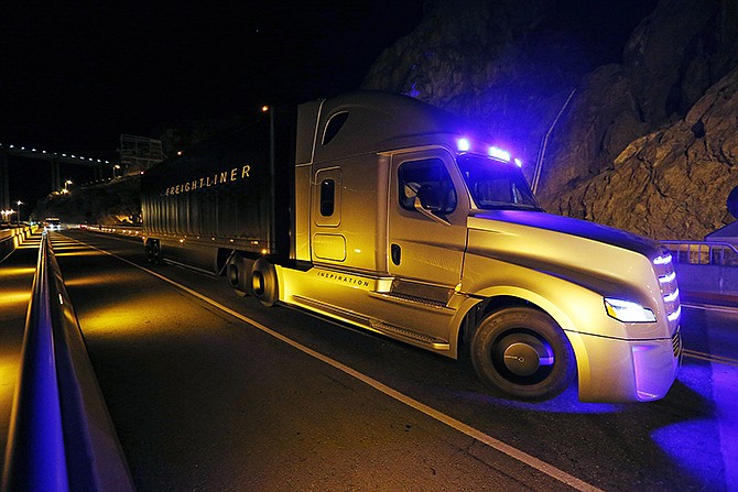 Freightliner unveils its Inspiration self-driving truck during an event at the Hoover Dam Tuesday near Boulder City, Nevada.