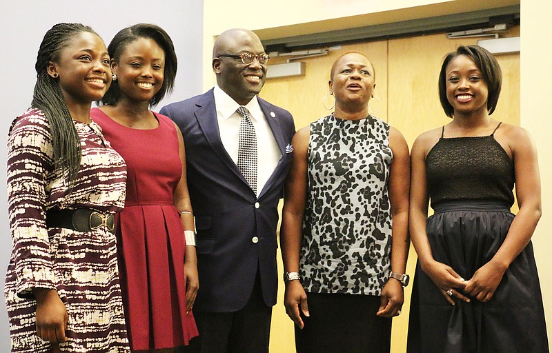 Benjamin Akande enters a lecture hall at Westminster College with his wife and three daughters Friday morning. The school named Akande to serve as its 21st president.