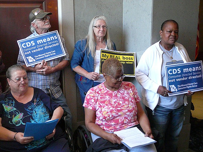 Several clients of home care services, including Marilyn Miller-Smith, Jefferson City (front, left), and Mary Woods, St. Louis (front, right), gathered at the Capitol this week to urge lawmakers to support pay increases for their attendants and caregivers. The Legislature's Joint Committee on Administrative Rules is scheduled to meet this morning to consider a rule approving those increases.