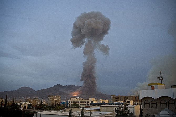 Smoke rises after a Saudi-led airstrike hit a site believed to be a munitions storage in Yemen's capital, Sanaa, on Monday. 