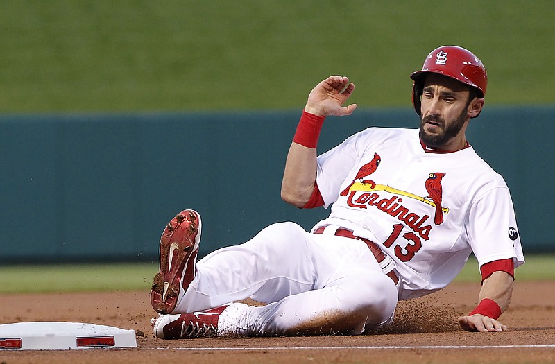 Matt Carpenter of the Cardinals, shown here sliding safely into third for a triple during a recent game against the Phillies at Busch Stadium, will return to the team today for its series against the Indians in Cleveland.