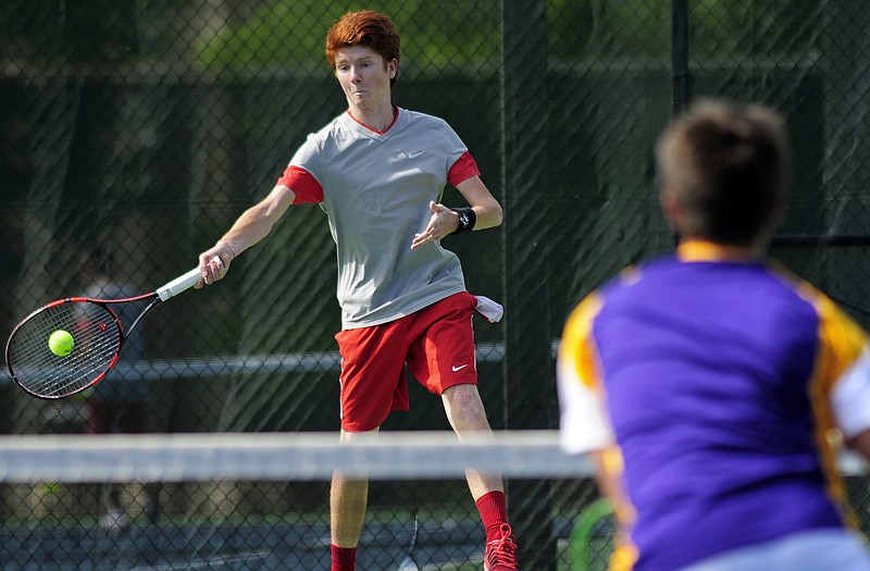 Jefferson City's Dane Biesemeyer returns the serve as he and Isaac Roling take on Hickman's #2 doubles tandem of Junyi Wu and Jacob Trout during Tuesday afternoon's match at Washington Park.