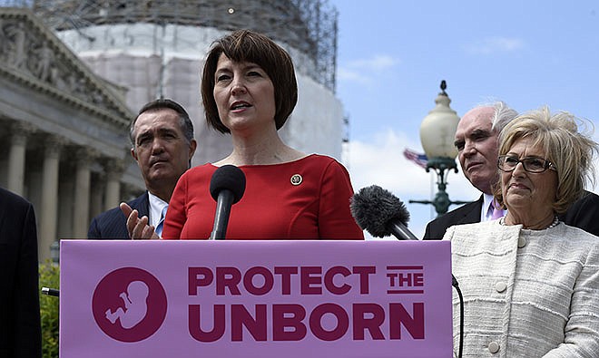 Rep. Cathy McMorris Rodgers, R.-Wash., center, speaks during a news conference Wednesday on the Pain-Capable Unborn Child Protection Act on Capitol Hill in Washington. Republicans predicted House passage Wednesday of the late-term abortion ban after dropping rape provisions that angered female GOP lawmakers and forced party leaders into an embarrassing retreat. Rep. Trent Franks, R-Ariz., left, and Rep. Mike Kelly, R-Pa., second from right, and Rep. Diane Black, R-Tenn., right, listen.