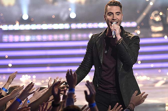 Nick Fradiani performs after he is announced as the winner at the American Idol XIV finale at the Dolby Theatre on Wednesday, May 13, 2015, in Los Angeles. 