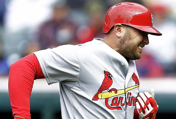 St. Louis Cardinals' Matt Holliday grimaces after getting hit by a pitch from Cleveland Indians starting pitcher Corey Kluber in the first inning of a baseball game, Wednesday, May 13, 2015, in Cleveland. Holliday left the game.