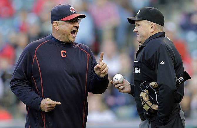 Cleveland Indians manager Terry Francona, left, argues with him plate umpire Mike Everitt after getting ejected in the fourth inning of a baseball game, Wednesday, May 13, 2015, in Cleveland. Francona was arguing with Everitt after Jason Kipnis was hit by a pitch from the starting pitcher John Lackey.