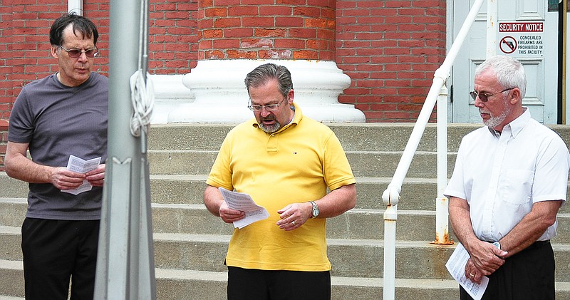 The New Life Christian Center pastor, Frank Hensley, opens the observance of the National Day of Prayer in front of the Moniteau County Courthouse at noon, Thursday, May 7.