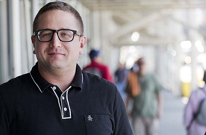 AP reporter Ken Sweet poses for a portrait, Thursday, May 14, 2015 in New York. Sweet borrowed $15,000 through a peer-to-peer loan, a rapidly expanding piece of the $3.4 trillion market for consumer debt, which includes credit cards and auto loans.