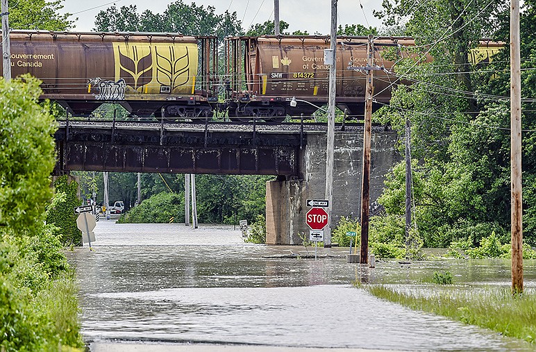 Roads were closed near U.S. 69 on Sunday, May 17, 2015, in Mosby, Mo., due to heavy flooding. Mosby police and the Fishing River Fire Department evacuated the city Sunday morning after thunderstorms overnight caused flooding throughout the Kansas City metropolitan area. 
