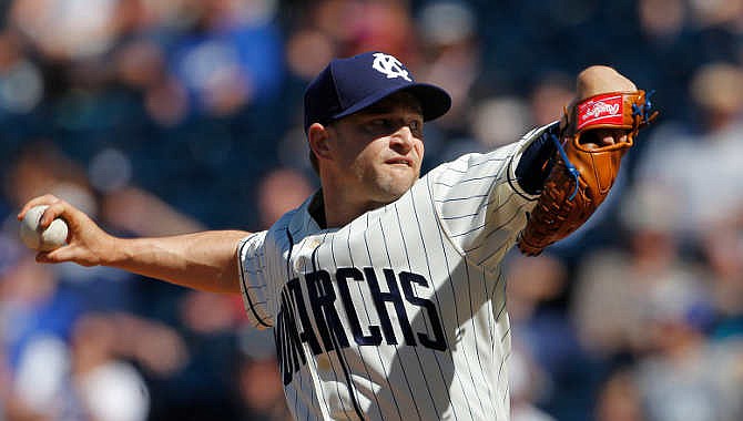 Kansas City Royals relief pitcher Jason Frasor, wearing a vintage Kansas City Monarchs uniform, throws in the ninth inning of a baseball game against the New York Yankees at Kauffman Stadium in Kansas City, Mo., Sunday, May 17, 2015.