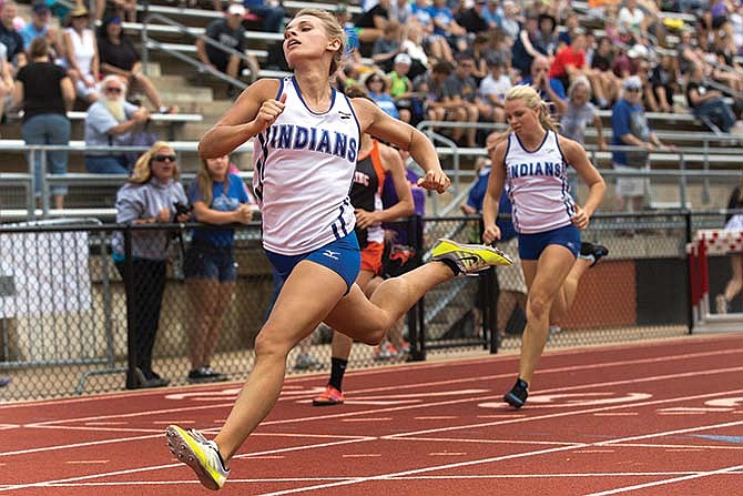 
Jordan Barnhart of Russellville lunges to the finish line to win the Class 2 girls 100-meter dash at Adkins Stadium in Jefferson City.