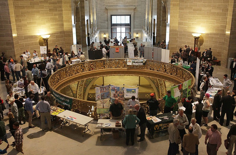 Booths promoting a variety of conservation interests fill the third-floor Rotunda as part of the recent Conservation Day at the Capitol.