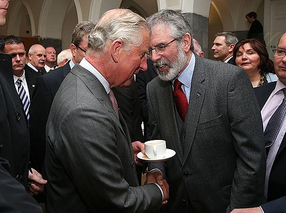 Britain's Prince Charles, left, shakes hands with Sinn Fein president Gerry Adams Tuesday at the National University of Ireland in Galway, Ireland. Prince Charles has begun an official visit to Ireland featuring a milestone of peacemaking: his first meeting with leaders of the Irish nationalist Sinn Fein party.