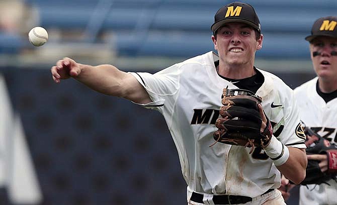 Missouri's Ryan Howard (8) throws to first base during the ninth inning of the Southeastern Conference college baseball tournament against South Carolina at the Hoover Met, Tuesday, May 19, 2015, in Hoover, Ala.