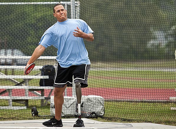 Brian Williams, an Air Force Wounded Warrior athlete prepares to throw the discus April 14, during introductory adaptive sports and rehabilitation camp at Eglin Air Force Base, Florida. Airmen gathered for a training camp hoping to defeat the Army, Marines and Navy next month at the 2015 Department of Defense Wounded Warrior Games in Quantico, Virginia.