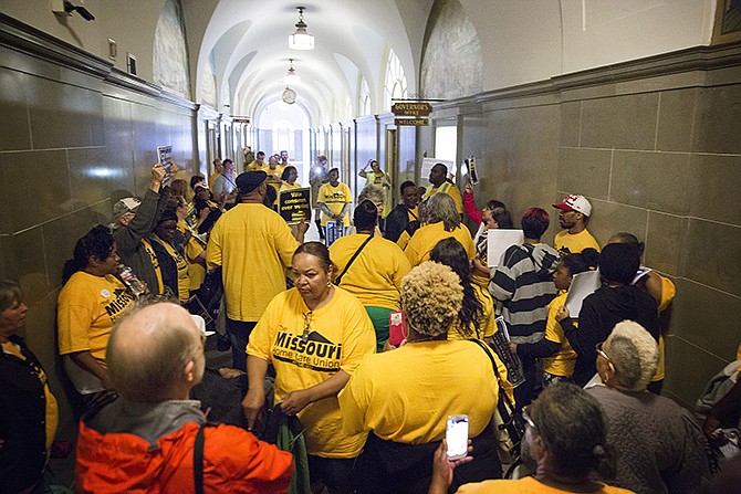 A group of about 80 people organized in protest Wednesday in front of Gov. Jay Nixon's office. Protesters hoped to gain a contract for home care workers.