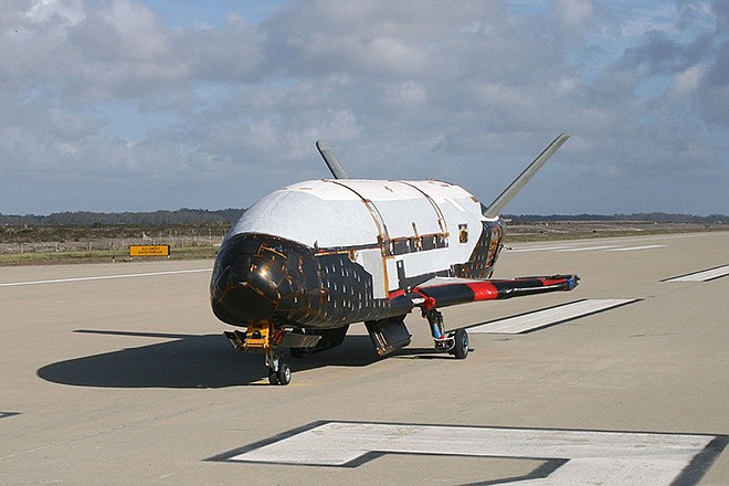 The X-37B Orbital Test Vehicle is shown at Vandenberg Air Force Base, California. On Wednesday, the Air Force launched its unmanned mini-shuttle from Cape Canaveral, Fla. Like the old shuttle, the X-37B launches vertically and lands horizontally, is reusable, and has lots of room for experiments. But no one flies on them; they are operated robotically.