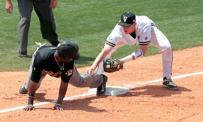 Missouri's Trey Harris (6) is called safe at third base from the tag by Vanderbilt's Will Toffey (10) during the sixth inning of a game at the Southeastern Conference college baseball tournament at the Hoover Met, Wednesday, May 20, 2015, in Hoover, Ala. 