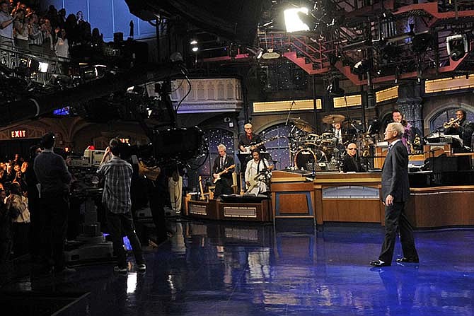 In this image released by CBS, David Letterman receives a standing ovation during the taping of his final "Late Show with David Letterman," Wednesday, May 20, 2015 at the Ed Sullivan Theater in New York. After 33 years in late night television, 6,028 broadcasts, nearly 20,000 total guest appearances, 16 Emmy Awards and more than 4,600 career Top Ten Lists, David Letterman is retiring.
