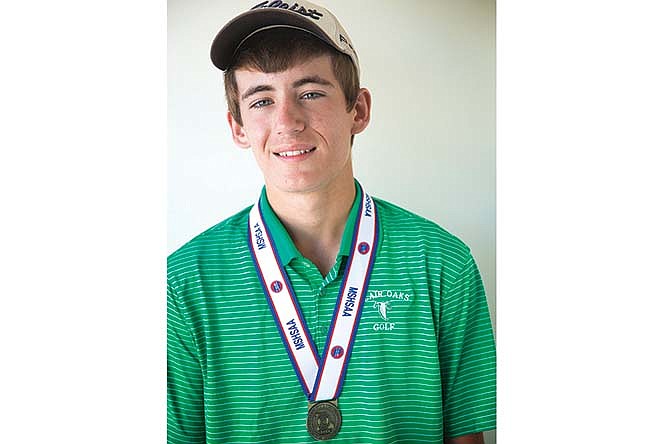 Tanner Elder of Blair Oaks poses with his Class 2 state golf championship medal.
