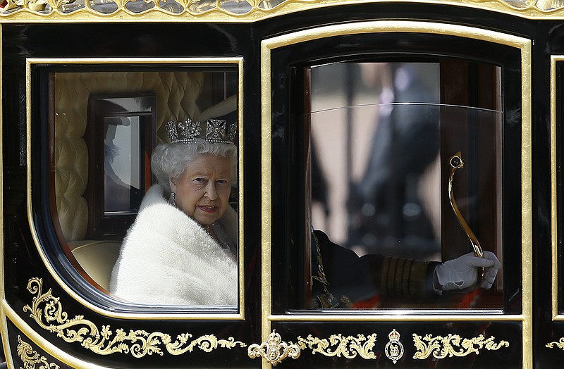 Britain's Queen Elizabeth II travels in a carriage from Buckingham Palace to Parliament to deliver the Queen's Speech.