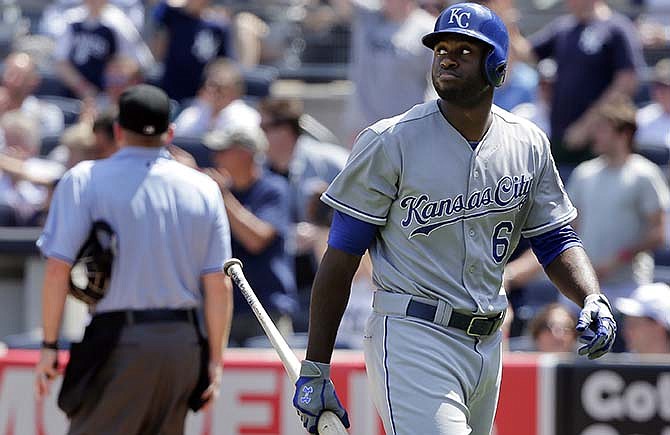 Kansas City Royals Lorenzo Cain looks back at the scoreboard after striking out with two men on base to end the top of the fifth inning of a baseball game against the New York Yankees, Wednesday, May 27, 2015, in New York. 